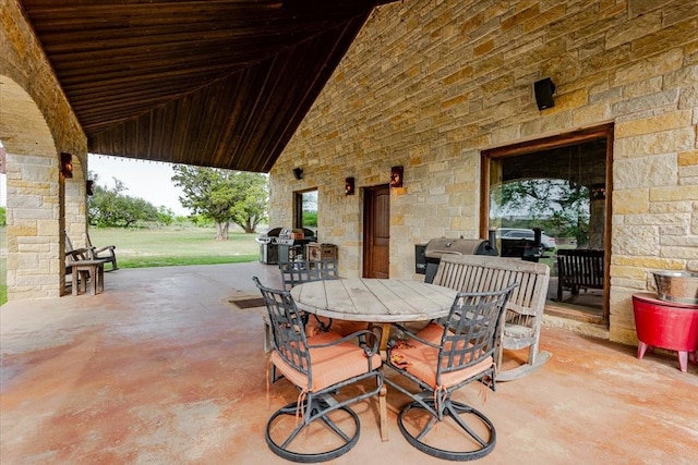 view of patio featuring a grill and outdoor dining space