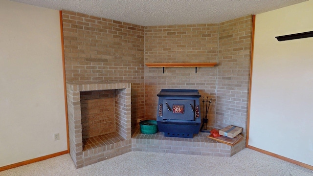 room details featuring a textured ceiling, carpet, a wood stove, and baseboards
