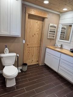 1081 Hoben Rd, Nocona, TX 76255 - bathroom with recessed lighting, toilet, and vanity