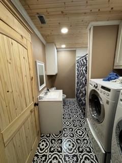 1081 Hoben Rd, Nocona, TX 76255 - laundry area with washer and clothes dryer, visible vents, a sink, wood ceiling, and cabinet space