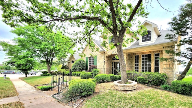 4406 Bay Valley Dr, Garland, TX 75043 - view of front of house with brick siding and a front yard