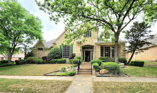 4406 Bay Valley Dr, Garland, TX 75043 - view of front of property with stone siding, brick siding, and a front yard