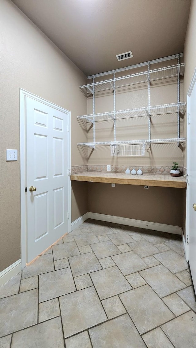 4406 Bay Valley Dr, Garland, TX 75043 - laundry room featuring visible vents and baseboards