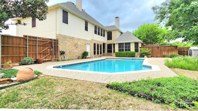 4406 Bay Valley Dr, Garland, TX 75043 - view of swimming pool featuring a sunroom, a fenced backyard, a fenced in pool, and a gate