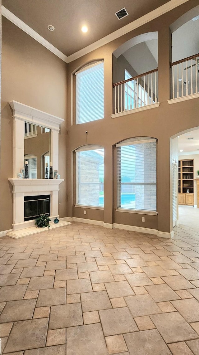 4406 Bay Valley Dr, Garland, TX 75043 - unfurnished living room featuring visible vents, baseboards, ornamental molding, and a high ceiling