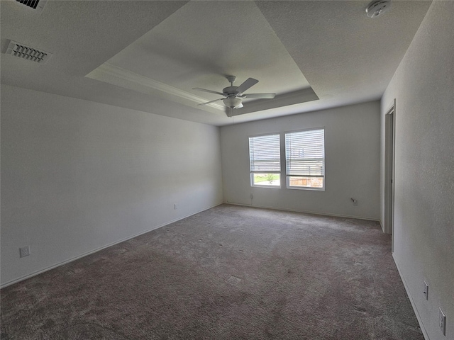 1020 Valerian Dr, Haslet, TX 76052 - spare room with a tray ceiling, carpet floors, a smoke detector, and a ceiling fan