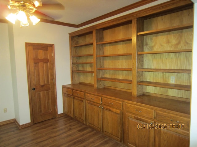 interior space with crown molding, baseboards, a ceiling fan, and wood finished floors