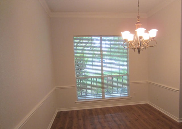 unfurnished room with a chandelier, wood finished floors, and crown molding