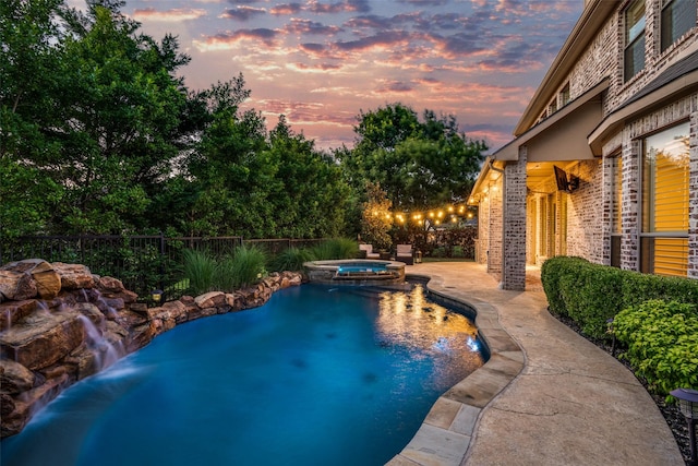1191 Broken Bend Dr, Prosper, TX 75078 - pool at dusk with a pool with connected hot tub and a patio