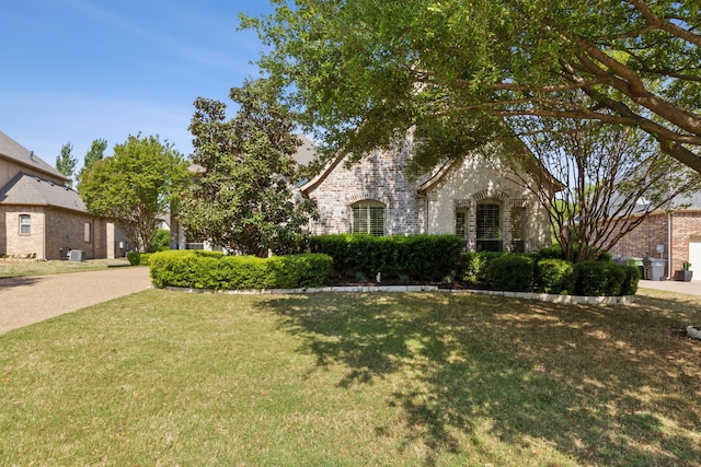 1191 Broken Bend Dr, Prosper, TX 75078 - view of front of home with a front lawn and brick siding