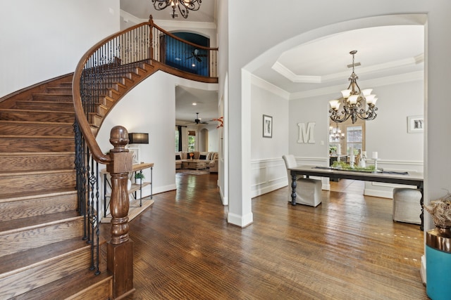 1191 Broken Bend Dr, Prosper, TX 75078 - entrance foyer with a chandelier, stairway, arched walkways, wood finished floors, and crown molding