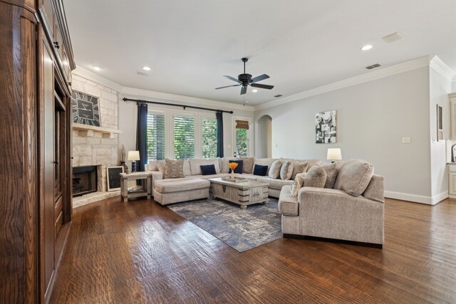 1191 Broken Bend Dr, Prosper, TX 75078 - living area with crown molding, a fireplace, dark wood finished floors, a ceiling fan, and recessed lighting