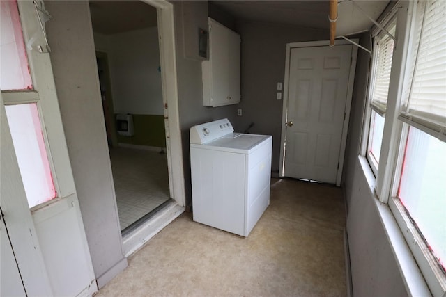 clothes washing area with laundry area, light carpet, and washer / clothes dryer