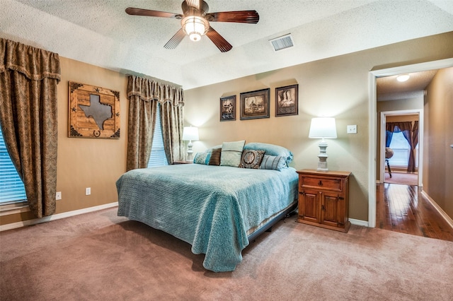 3451 Sudith Ln, Midlothian, TX 76065 - bedroom with carpet, a textured ceiling, baseboards, and a ceiling fan