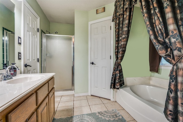 3451 Sudith Ln, Midlothian, TX 76065 - bathroom featuring a stall shower, tile patterned flooring, vanity, and a garden tub