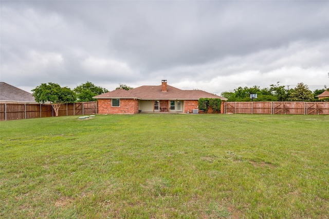 3451 Sudith Ln, Midlothian, TX 76065 - rear view of house with a chimney and brick siding