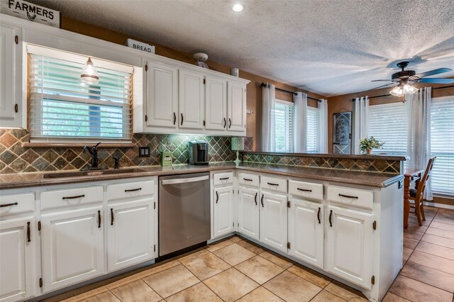 3451 Sudith Ln, Midlothian, TX 76065 - kitchen featuring dishwasher, dark countertops, a peninsula, decorative backsplash, and recessed lighting