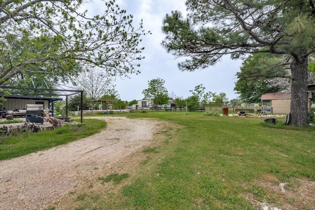 view of street with dirt driveway