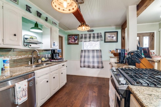 kitchen with crown molding, a sink, white cabinetry, and appliances with stainless steel finishes