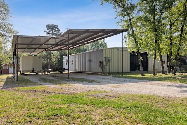 view of parking / parking lot featuring driveway and a carport