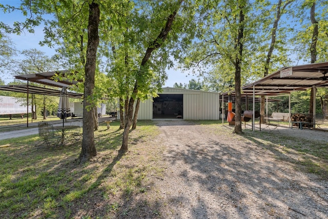 view of yard with an outdoor structure and an outbuilding