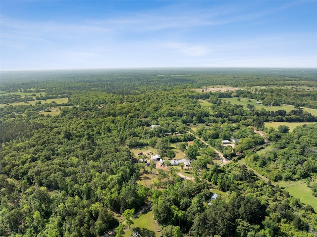 drone / aerial view featuring a view of trees