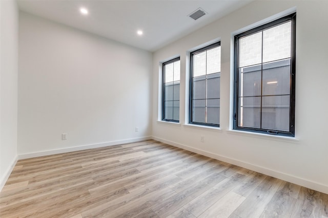 1775 Novela Way, Dallas, TX 75215 - empty room featuring light wood-style floors, baseboards, and recessed lighting