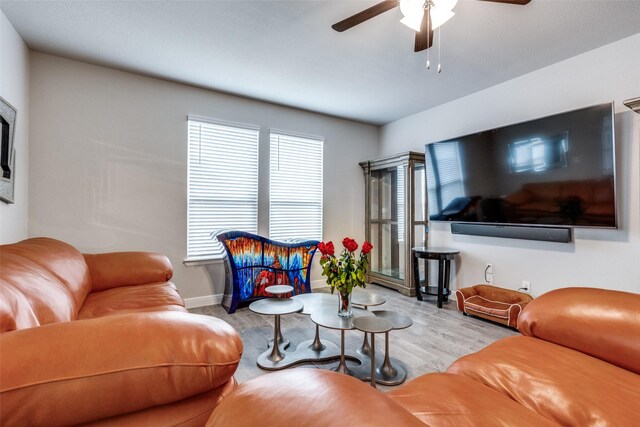 736 Wilmott Ter, Fort Worth, TX 76247 - living room featuring a ceiling fan, baseboards, and wood finished floors