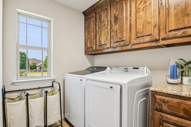 laundry area with cabinet space and washing machine and dryer
