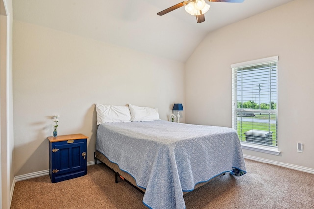carpeted bedroom with ceiling fan, vaulted ceiling, and baseboards