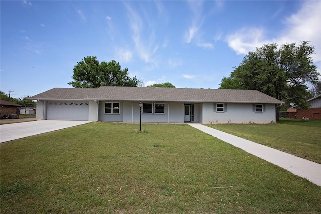 single story home featuring concrete driveway, brick siding, a front yard, and a garage