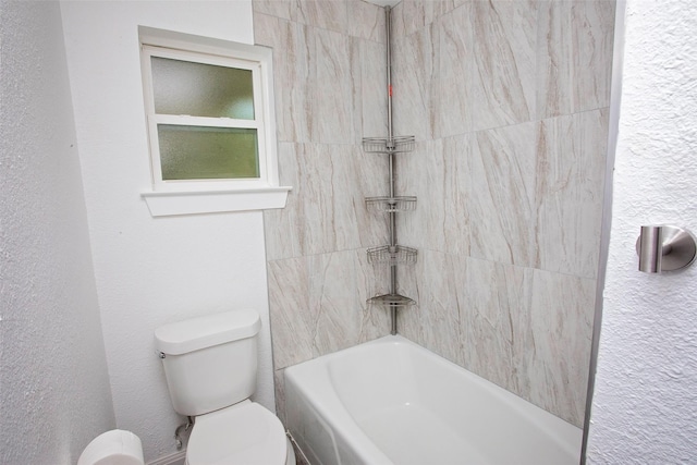 bathroom featuring toilet and shower / washtub combination
