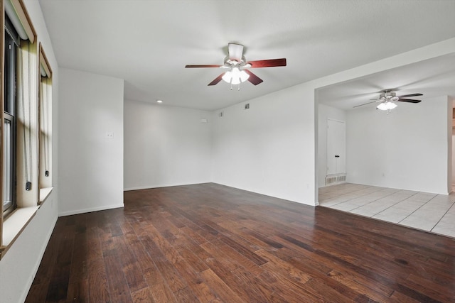 spare room with a ceiling fan and hardwood / wood-style floors