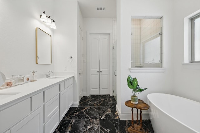 full bathroom with a shower stall, marble finish floor, visible vents, a sink, and baseboards