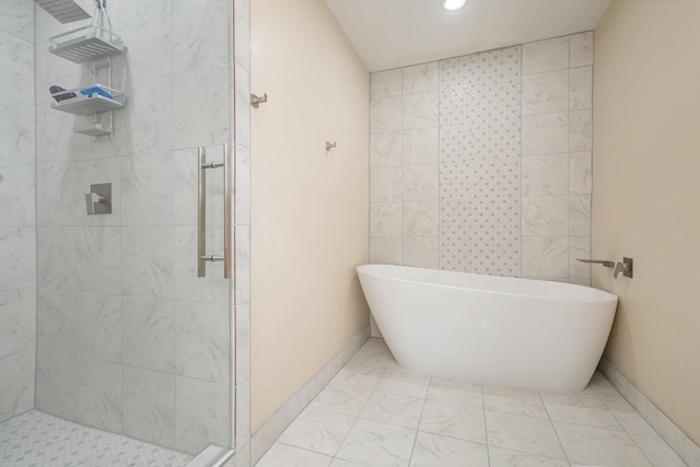 full bathroom with marble finish floor, recessed lighting, a soaking tub, and a stall shower