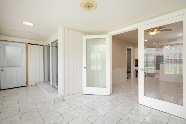 interior space with visible vents, marble finish floor, and ceiling fan