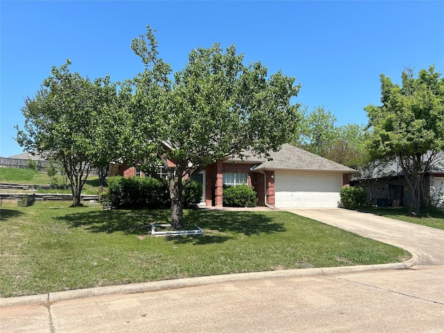 obstructed view of property with concrete driveway, brick siding, a front yard, and a garage