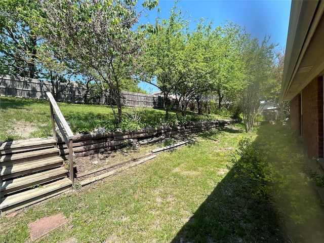 view of yard with a fenced backyard
