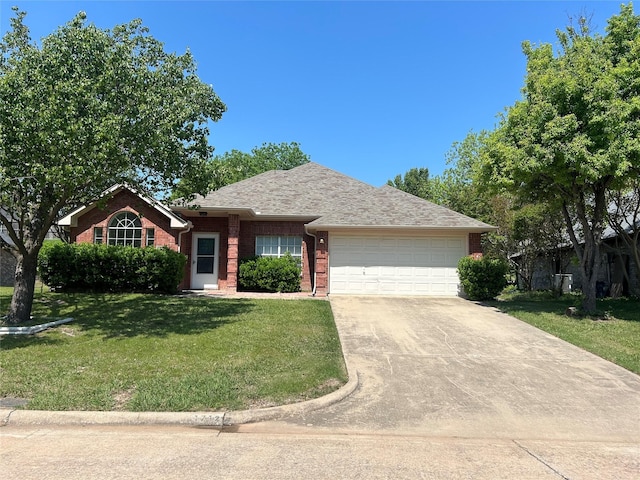 ranch-style home featuring a front lawn, driveway, a shingled roof, a garage, and brick siding