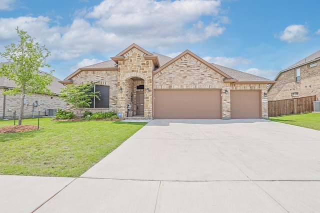 4125 Stockman Dr, Krum, TX 76249 - french country home with driveway, a garage, roof with shingles, cooling unit, and stone siding