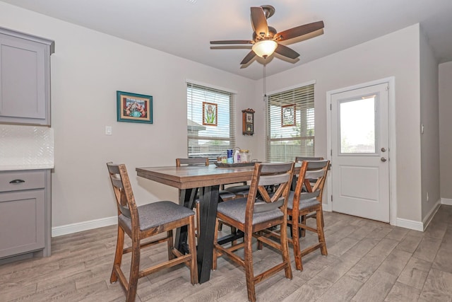 4125 Stockman Dr, Krum, TX 76249 - dining room featuring light wood-type flooring, ceiling fan, and baseboards