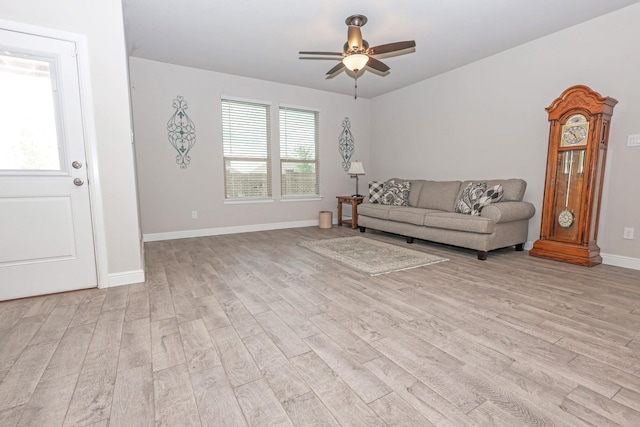 4125 Stockman Dr, Krum, TX 76249 - living room featuring light wood-type flooring, a ceiling fan, and baseboards