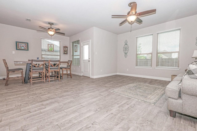 4125 Stockman Dr, Krum, TX 76249 - living room featuring a ceiling fan, plenty of natural light, and wood finished floors