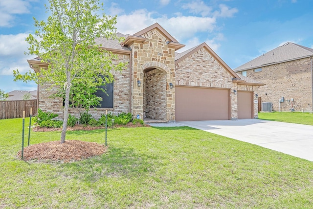 4125 Stockman Dr, Krum, TX 76249 - french provincial home featuring a garage, driveway, central AC, and brick siding