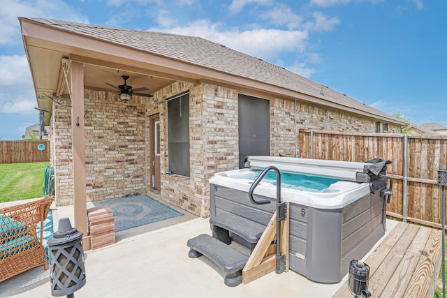 4125 Stockman Dr, Krum, TX 76249 - fenced backyard with a hot tub, ceiling fan, a patio, and a deck