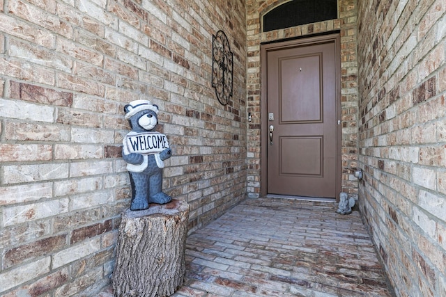 4125 Stockman Dr, Krum, TX 76249 - view of exterior entry featuring brick siding and covered porch