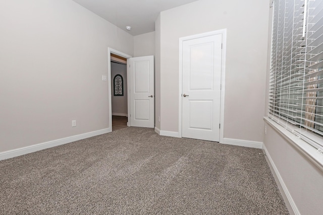 4125 Stockman Dr, Krum, TX 76249 - unfurnished bedroom featuring carpet flooring and baseboards