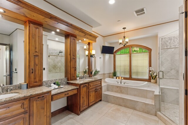 full bathroom featuring a garden tub, visible vents, a shower stall, two vanities, and a sink