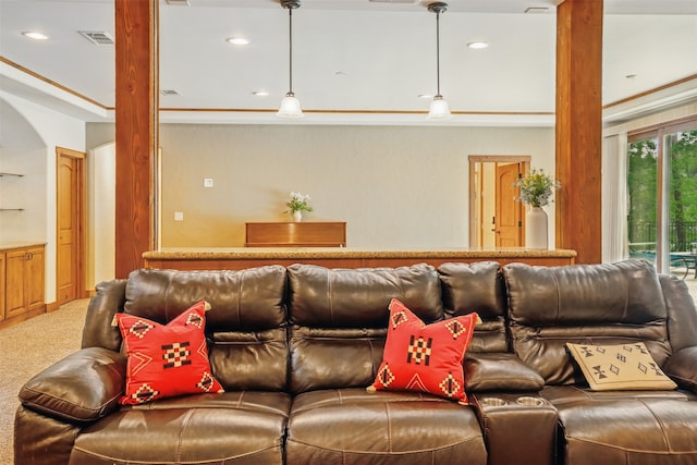 carpeted living room featuring arched walkways, recessed lighting, and visible vents