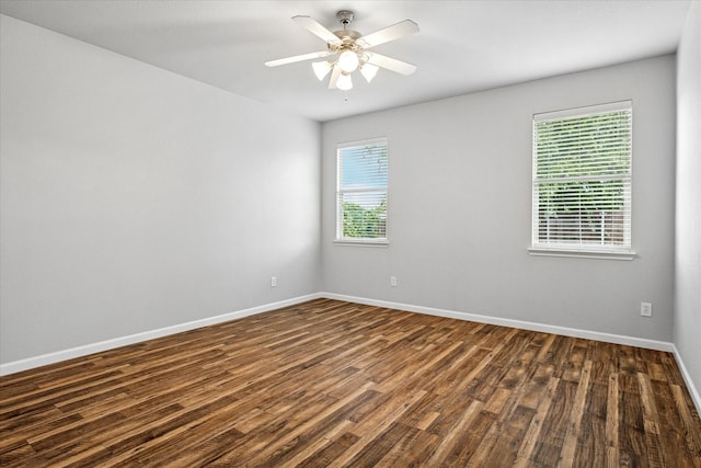 5208 Hidden Knolls Dr, Mckinney, TX 75071 - empty room with dark wood-style floors, baseboards, and ceiling fan